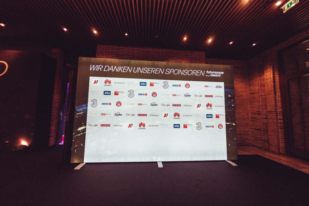 Large display board at an awards event showing sponsor logos and the German phrase 'Wir danken unseren Sponsoren' (We thank our sponsors).